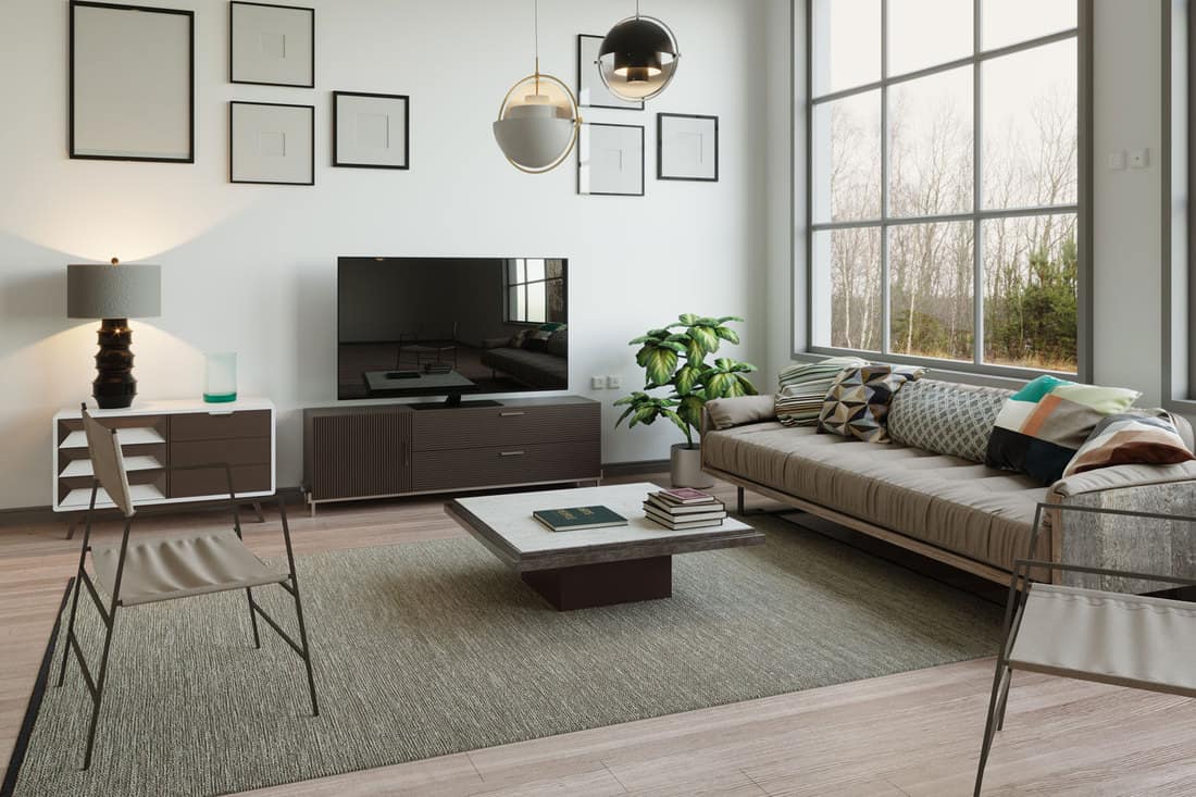 Interior of an ultra modern contemporary living rom with a carpet and a table on the center, How To Float Furniture In A Living Room