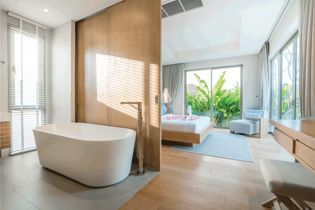 Luxury Interior design in bedroom of pool villa with cozy bed and build in bathtub with bright lighting. Do Master Bedrooms Typically Have Bathrooms
