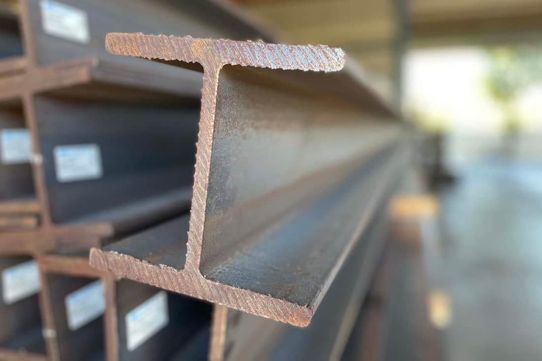 Metal profile beam steel in packs at the warehouse of metal products