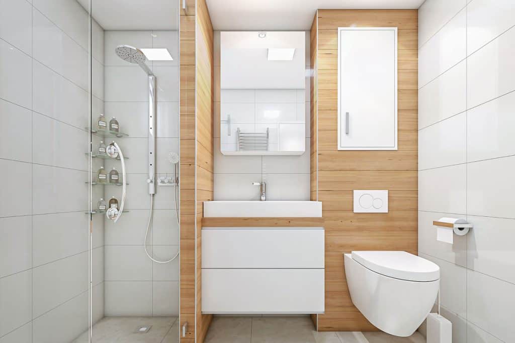 Modern luxurious bathroom with wooden cladding and stainless steel fixtures, How High Should A Bathroom Cabinet Be Hung Over The Toilet?