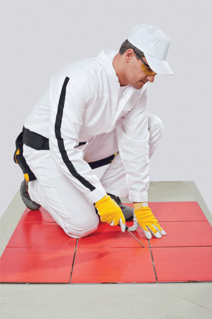 Sharp tool clean spaces between tiles remove tile adhesive