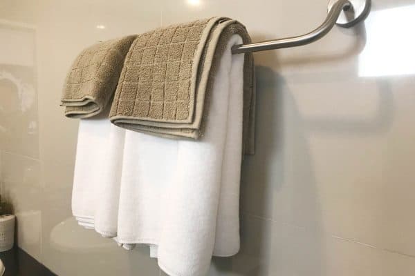 Read more about the article Should You Hang Towels Over The Toilet? [And How High Above?]