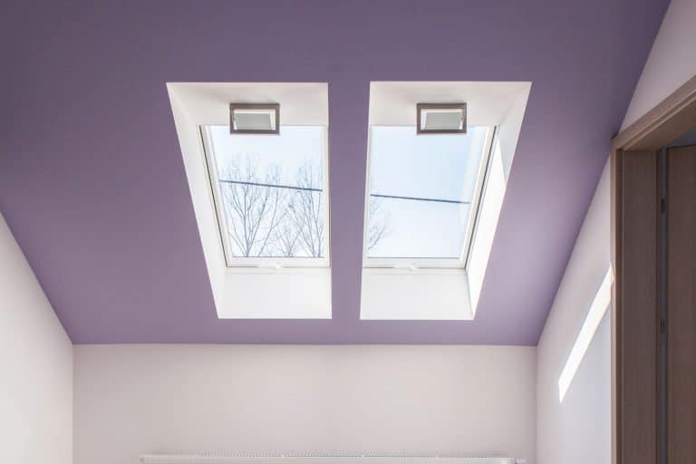 Violet slanted ceiling in empty attic room, What Color Do You Paint A Sloped Ceiling?