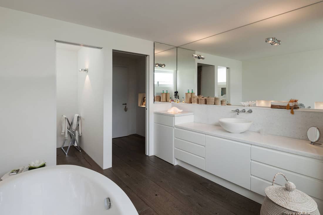comfortable bathroom in modern design, wooden floor