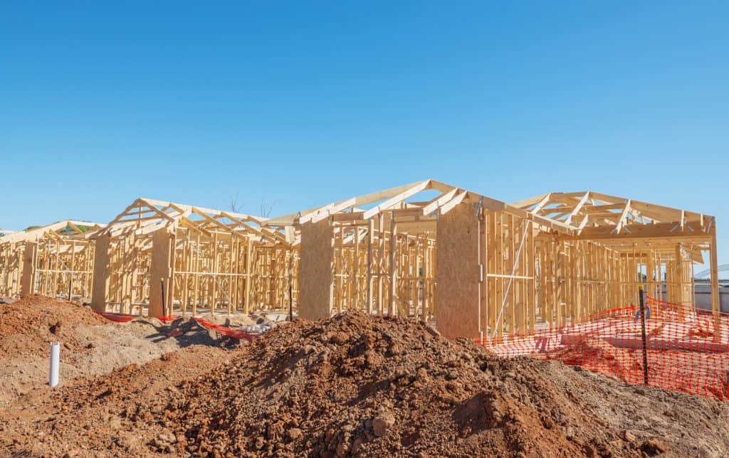 new suburban homes currently under construction in row