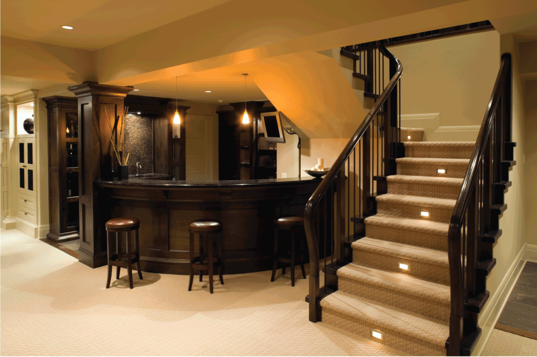 refined basement bar in a luxury estate home with dark wood accent