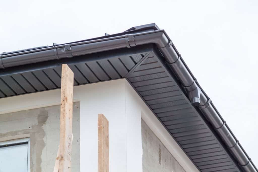 A brilliantly made gutter painted in metallic gray including the eaves