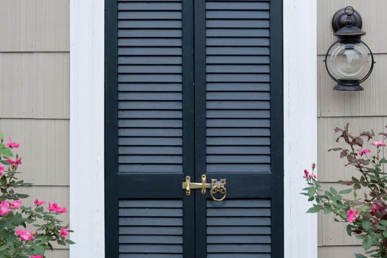 A louvered blue front door in St. Michael's, Maryland, How To Paint A Louvered Door [A Complete Guide]