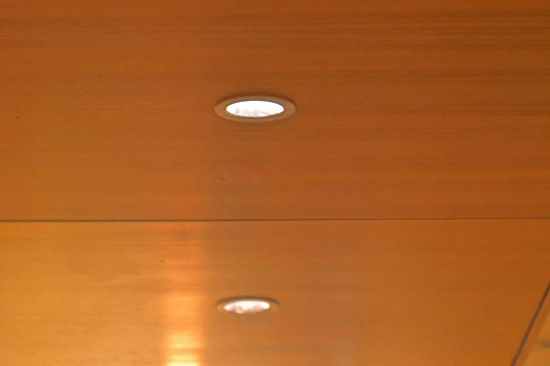 A wooden texture ceiling with modern pin lighting, 12 Types Of Recessed Lighting [And 4 Types Of Compatible Lightbulbs]