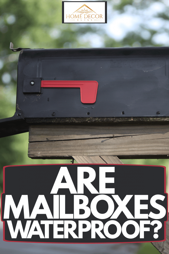 A black opened mailbox attached to a wooden frame, Are Mailboxes Waterproof?