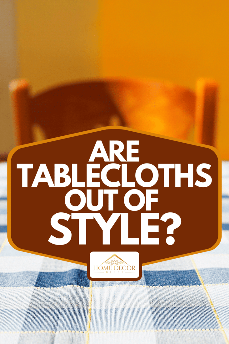 A restaurant table with a checkered tablecloth on the street, Are Tablecloths Out Of Style?