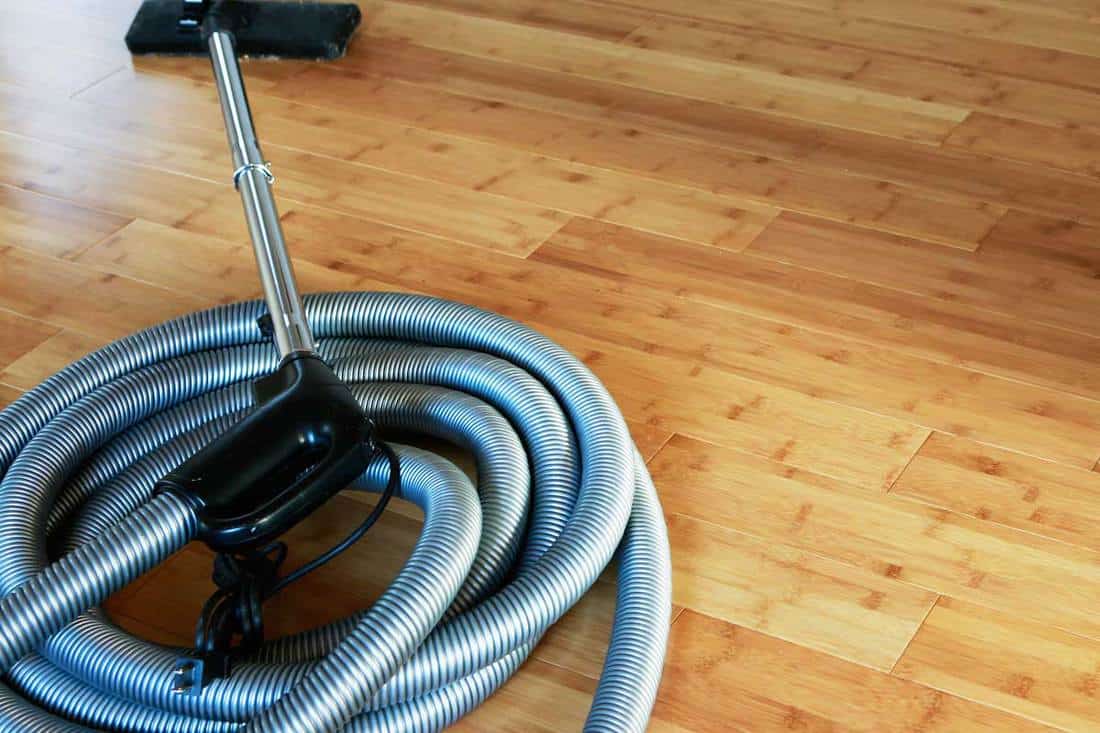 Beautiful bamboo hardwood floor with a central vacuum cleaner, 3 Types Of Central Vacuum Hoses To Know