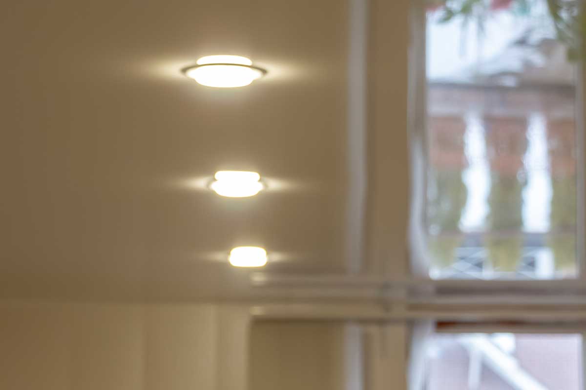 Built-in LED ceiling lights on a glossy stretch ceiling, How To Reduce Glare From Recessed Lighting