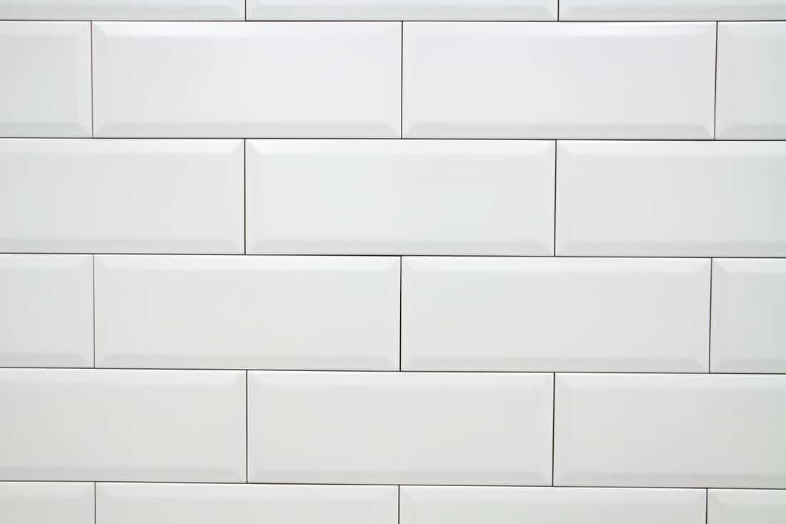 Close up white vintage ceramic brick tile wall