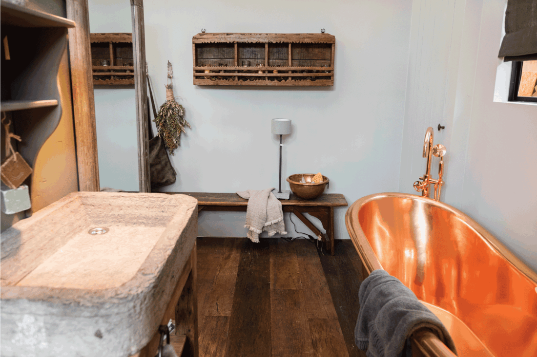 Detail of bath room decoration. Copper tub