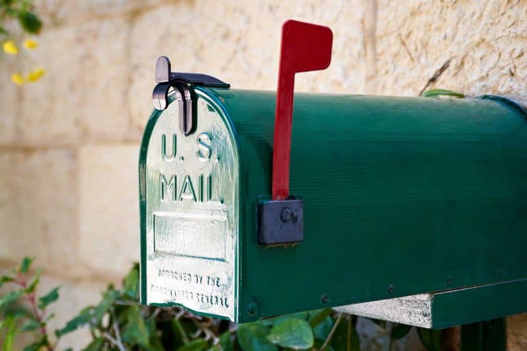 Green US post mail letter box with red flag raised up, Does The Flag On A Mailbox Have To Be Red?