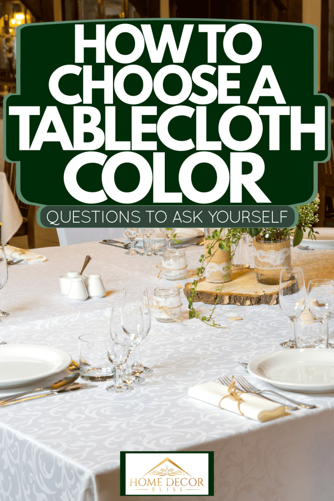 A luxurious restaurant incorporated with white clothing and wooden chairs, How To Choose A Tablecloth Color - Questions To Ask Yourself