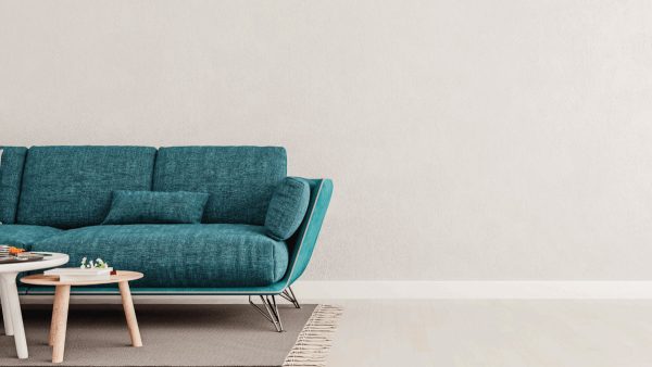 Living room interior wall mock up with teal blue sofa, empty white wall with free space on right. 11 Living Room Ideas With Teal Sofa - 1600x900