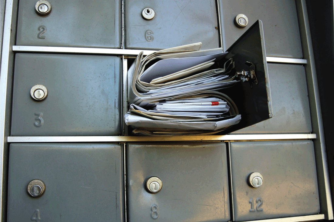 Mail box overflowing with mail