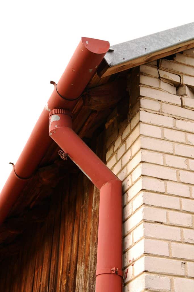 Red pre-painted gutter with metal down spout