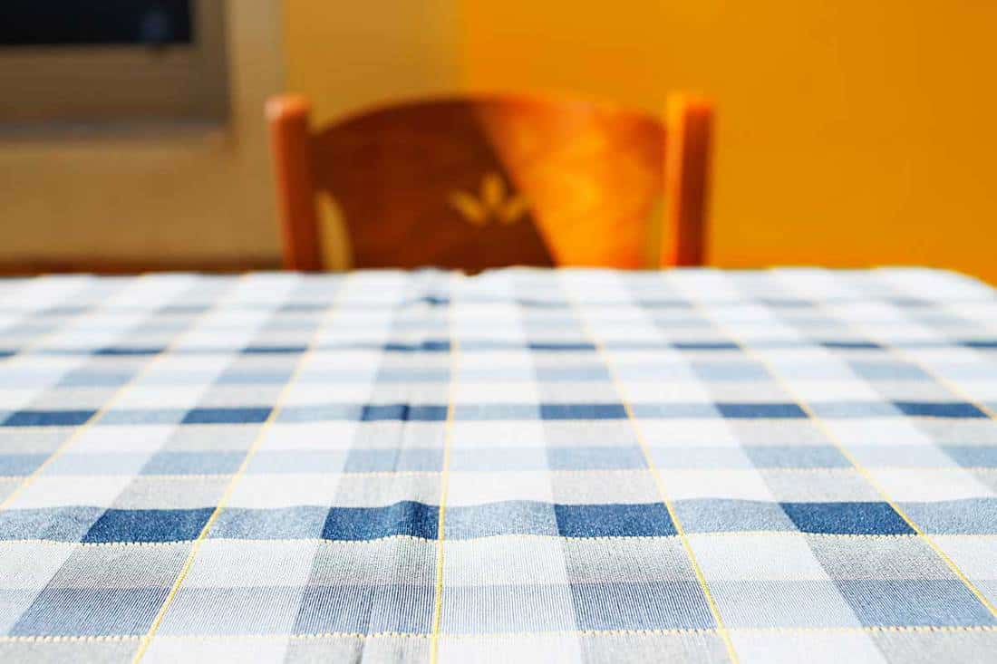 Restaurant table with a checkered tablecloth on the street, Are Tablecloths Out Of Style?
