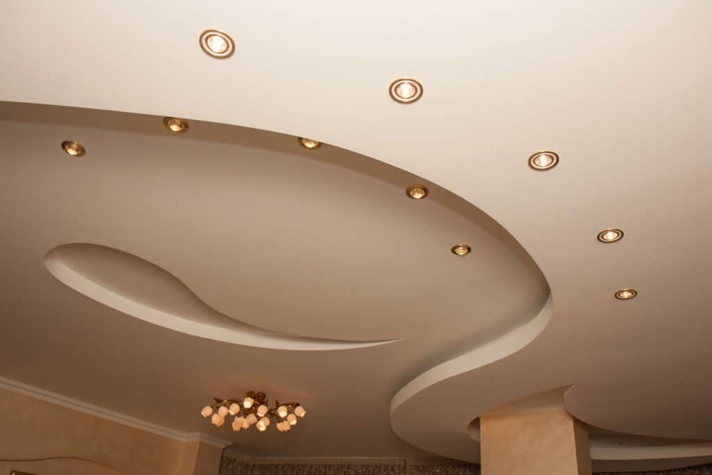Teardrop designed ceiling with yellow pin lights inside the ground floor of a five star hotel