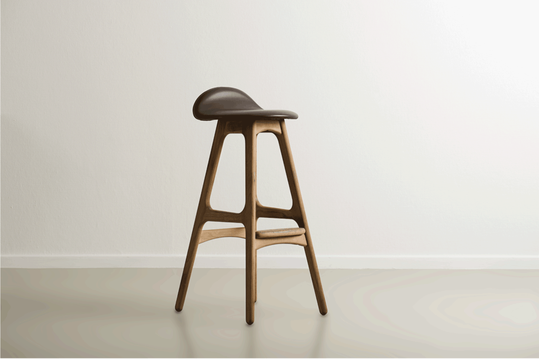 Wooden bar stool with a molded leather seat
