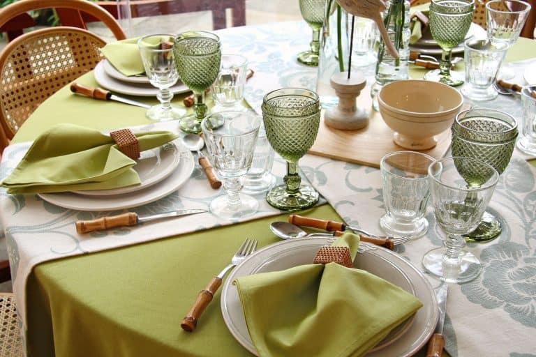 tables assembled with sophisticated dishes, cutlery, glasses and flowers, Should Napkins Match The Tablecloth?
