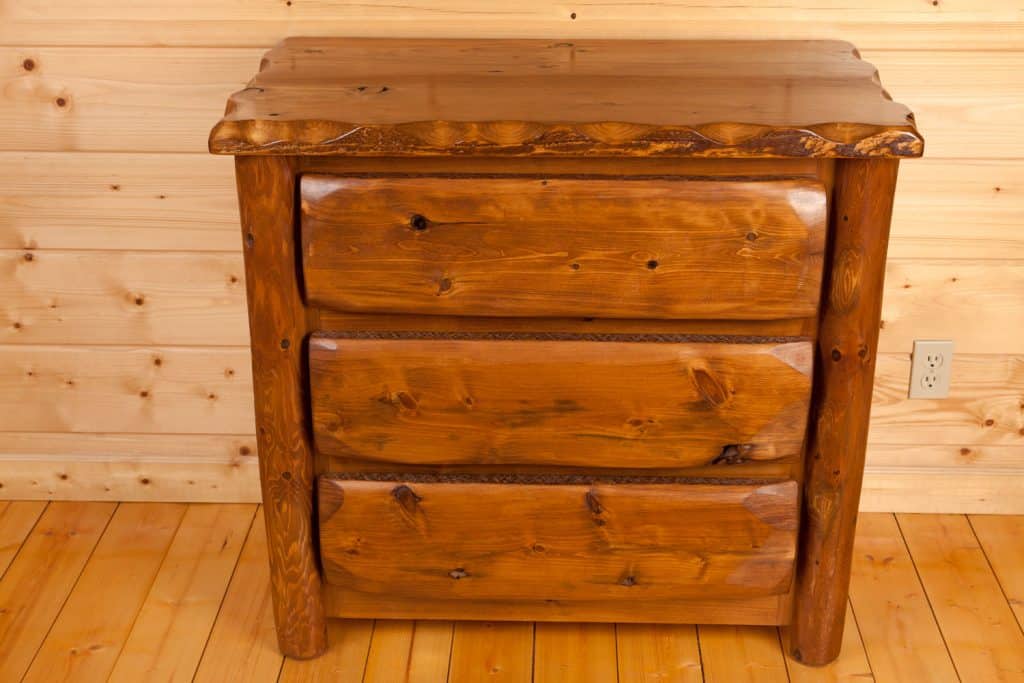 A gorgeous rustic accent chest on the side of the living room