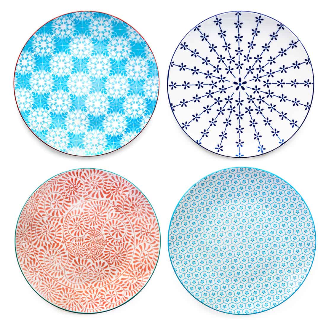 Collection of empty colorful plates. Top view, isolated on white. Variety of patterns.