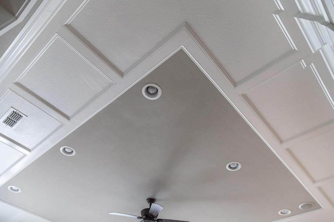 Grey and white ceiling with recessed lighting