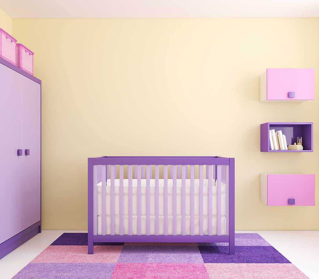 Modern interior of a purple themed nursery room
