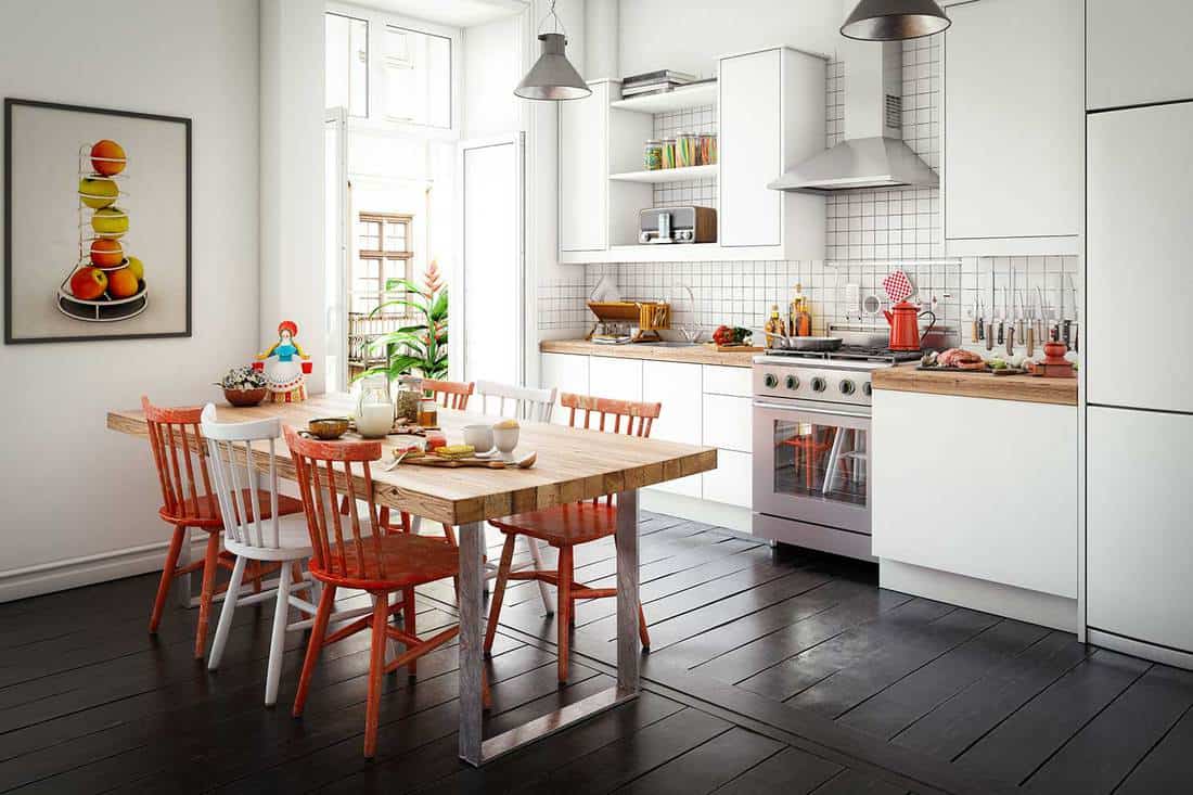 Scandinavian domestic kitchen and dining room with hardwood floor