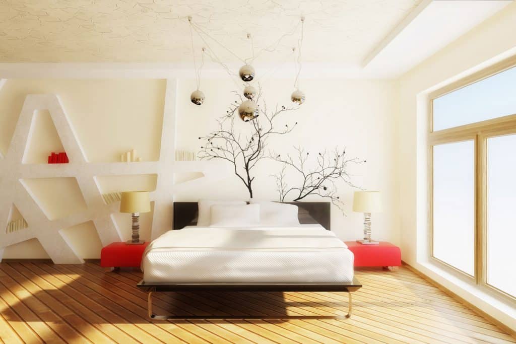 White painted modern interior bedroom with a huge window on the side red nightstands, and a white mattress