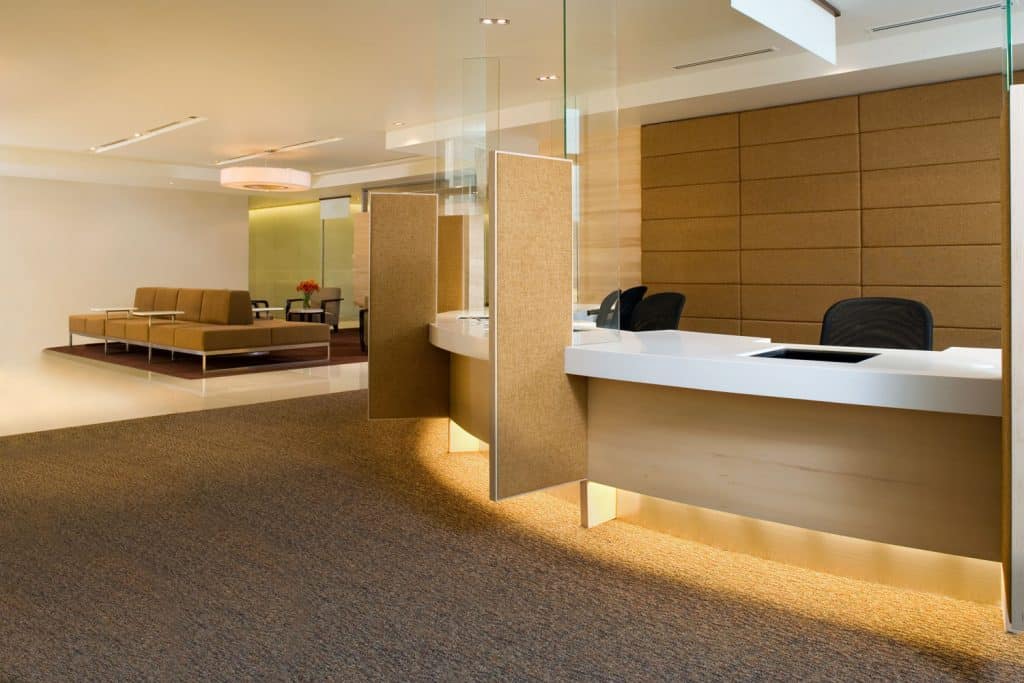 A luxurious interior of a hotel concierge with carpet padding and rustic designs