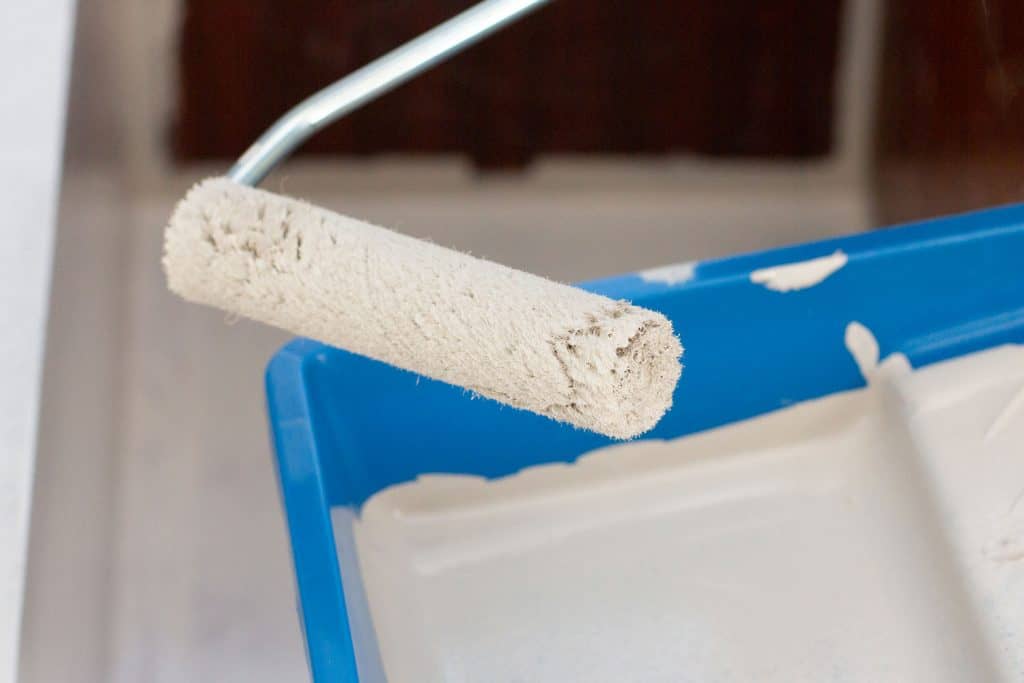 Applying primer to a furniture using a roller