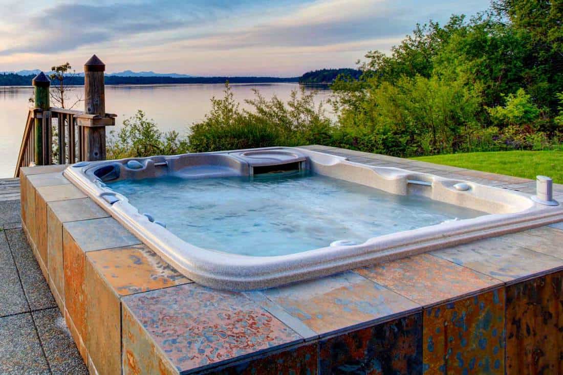 Awesome water view with hot tub at dusk, 21 Amazing Outdoor Jacuzzi And Hot Tub Ideas