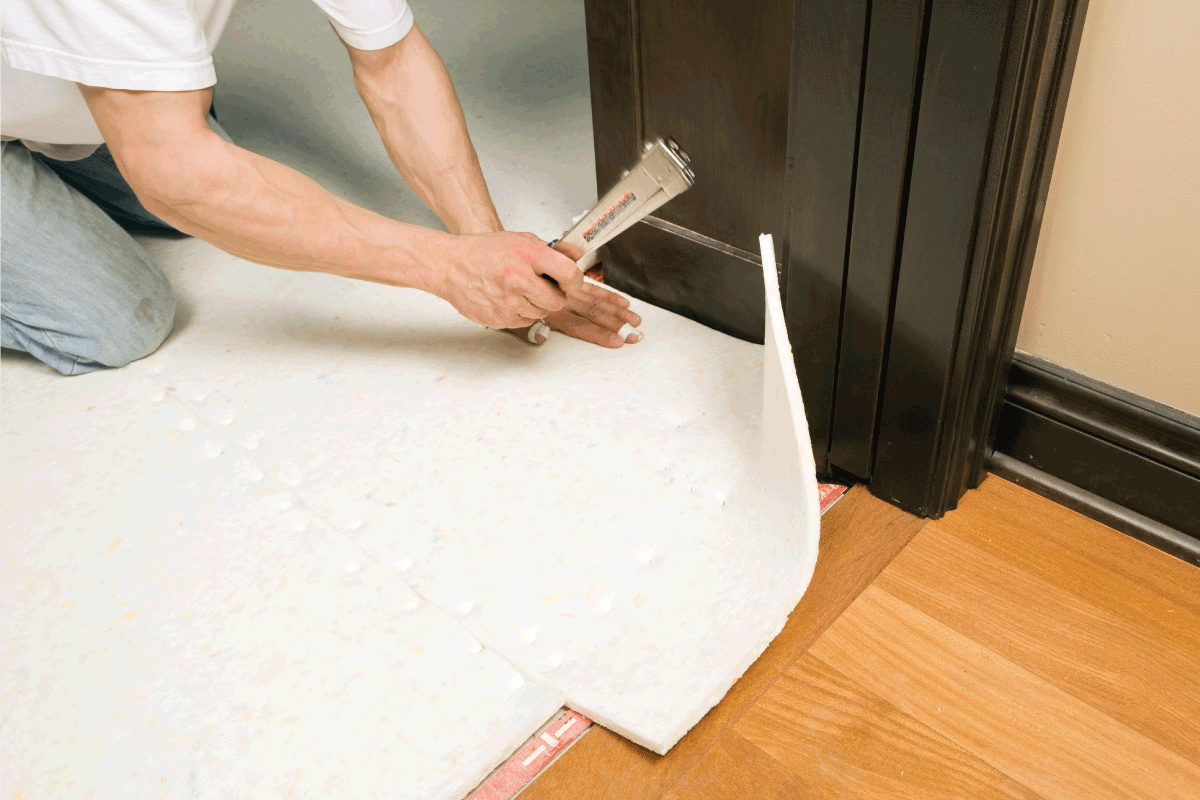 Carpet Installer Stapling Pad to Subfloor. What Kind Of Stapler Do You Use For Carpet