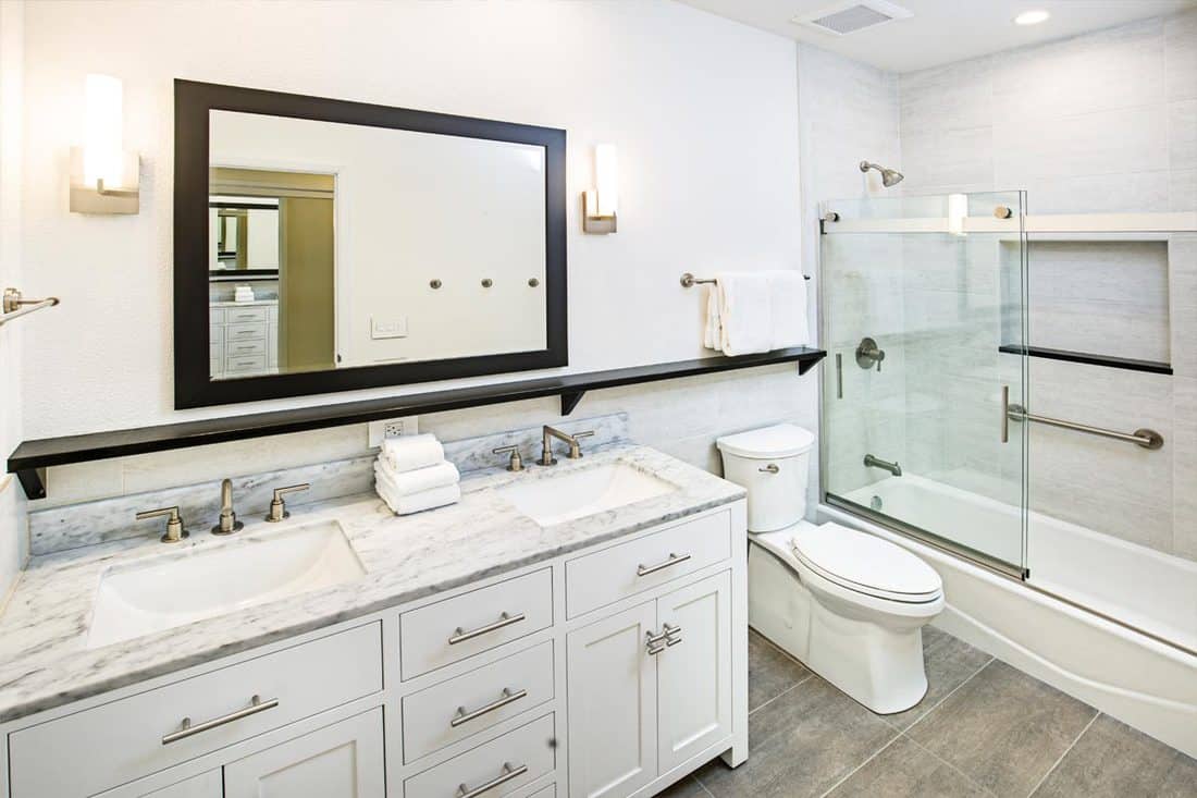 Contemporary bathroom design with vanity and shower bathtub, What Color Mirror Goes With A White Vanity?