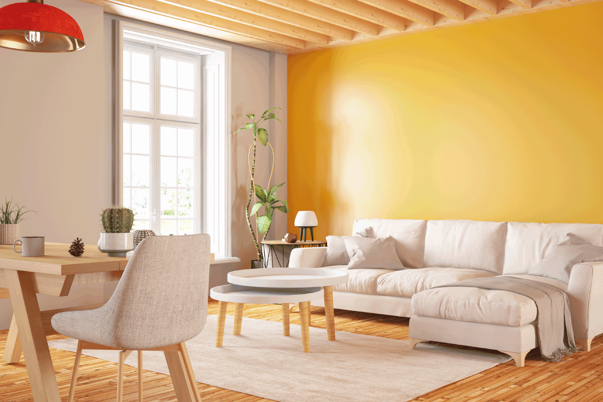 Cozy Yellow Living Room with Table and Sofa. What Wallpaper Goes With Yellow Walls