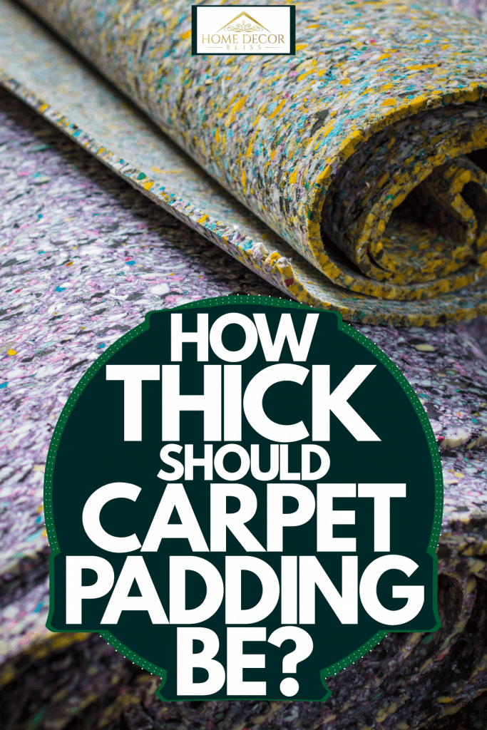 A thick carpet padding rolled and stored, How Thick Should Carpet Padding Be?
