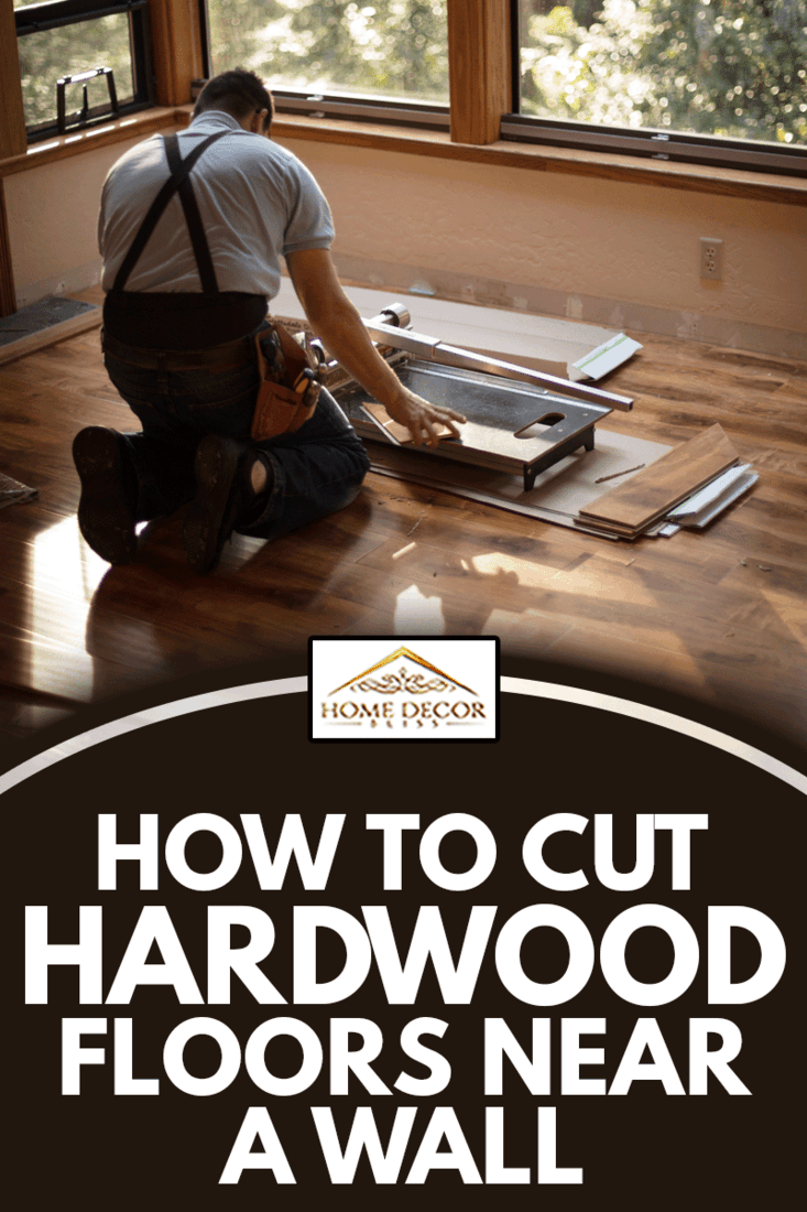 Man installing wood flooring in home, How To Cut Hardwood Floors Near A Wall