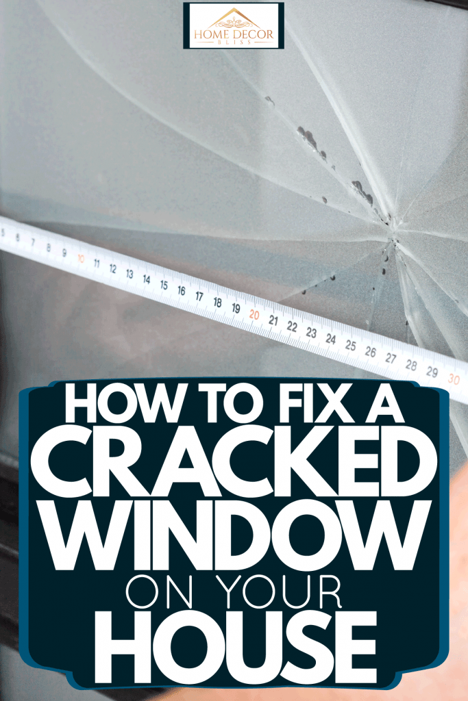 A professional measuring the window with a huge crack in it, How To Fix A Cracked Window On Your House