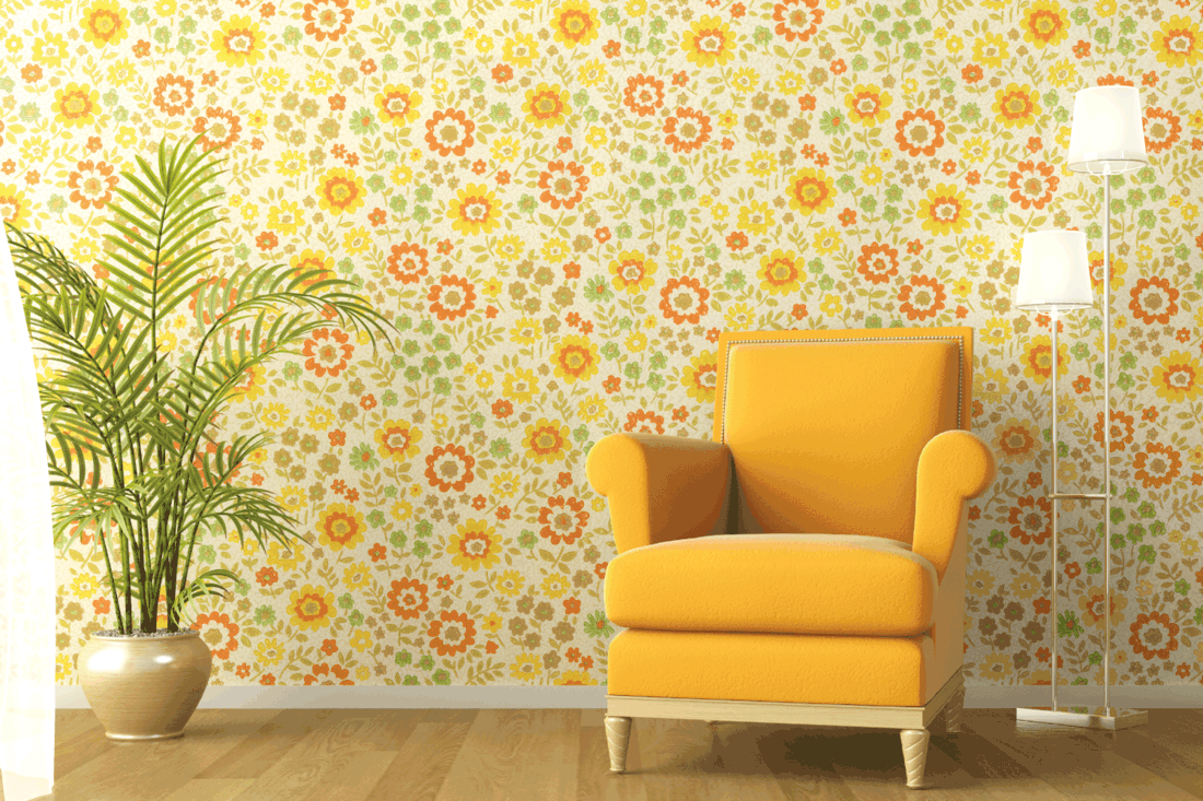 Interior with armchair and flowery wallpaper. What Wallpaper Goes With Yellow Walls