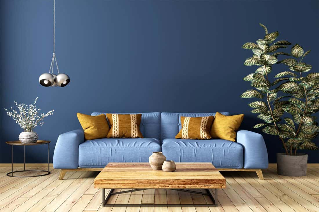A modern interior design of living room with blue couch and a wooden coffee table, What Color Coffee Table With A Blue Couch?