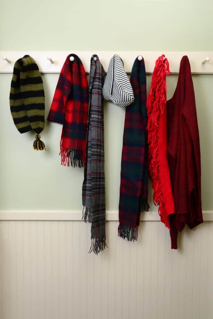 Scarfs and other window clothing hanged on hooks