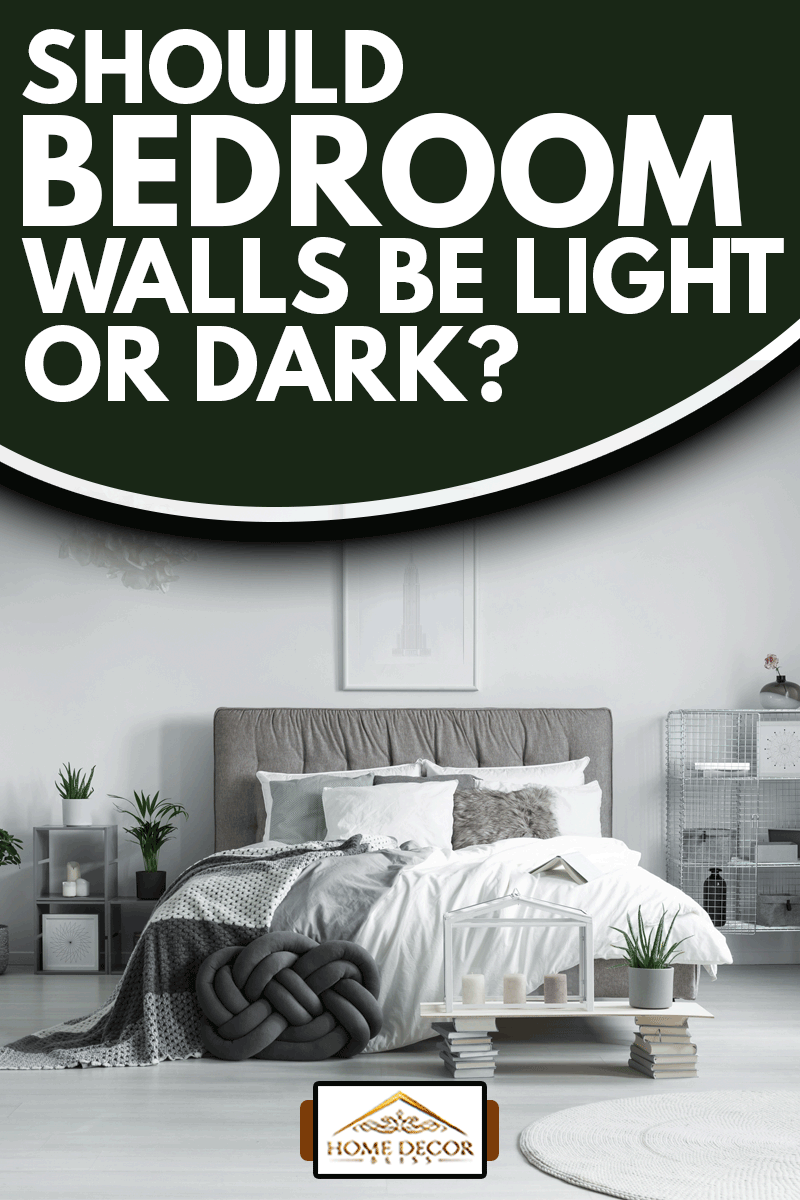 Many pillows lying on a king-size bed in a bedroom filled with plants with light colored paint wall, Should Bedroom Walls Be Light or Dark?