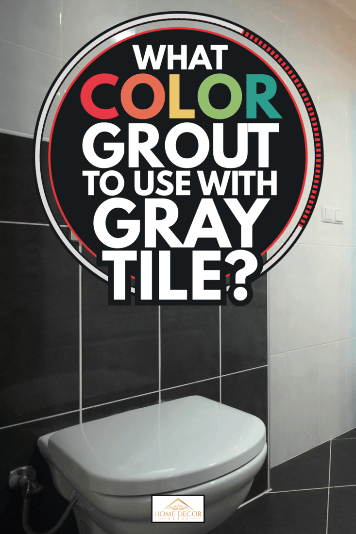 domestic bathroom with dark gray tiles, white ceramic toilet bowl. What Color Grout To Use With Gray Tile