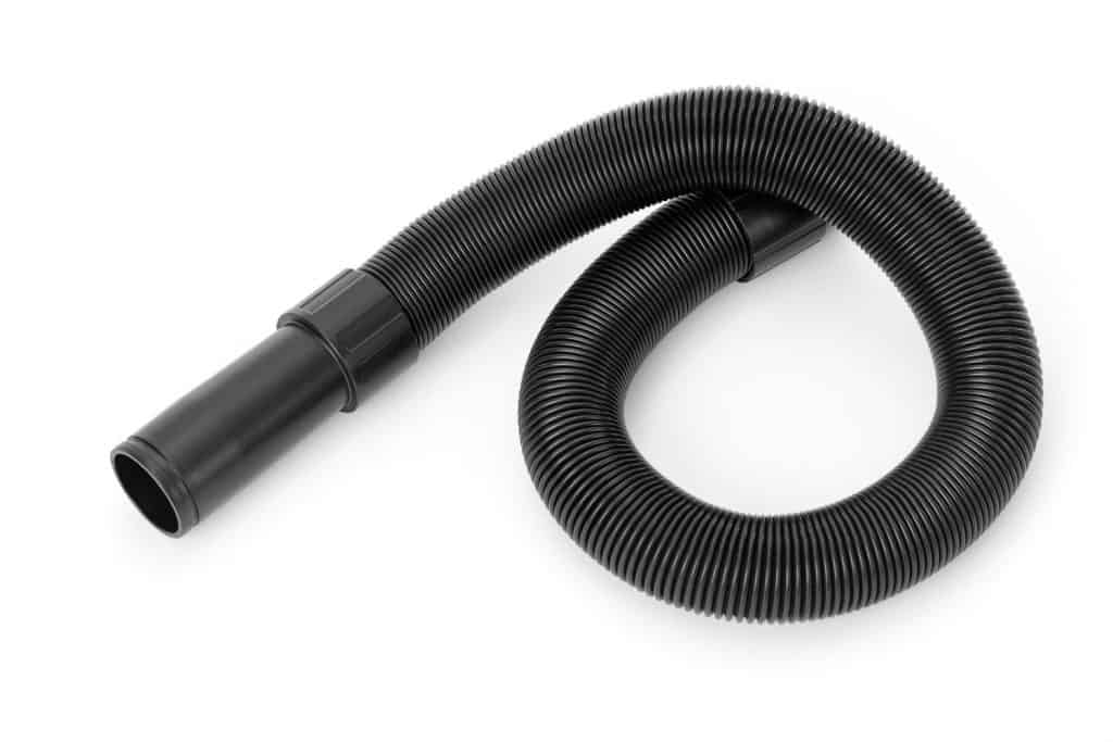 A black vacuum hose on a white background