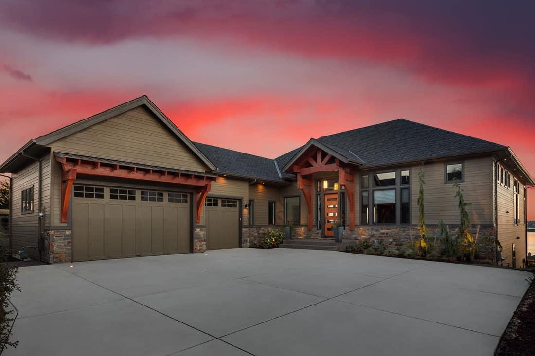 Beautiful Luxury Home Exterior at Sunset with Colorful Sky, How To Fill The Gap Between Driveway And Garage
